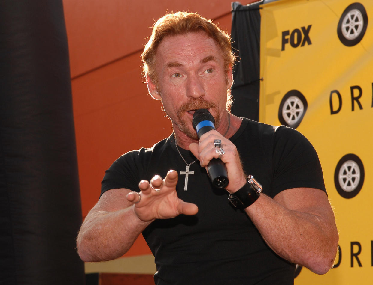 Danny Bonaduce, 63, is set to undergo brain surgery for hydrocephalus (Getty Images), what is hydrocephalus, Danny Bonaduce speaking into microphone wearing black t-shirt