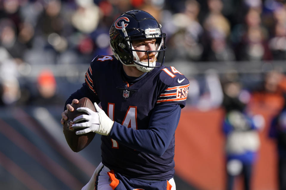 Chicago Bears quarterback Andy Dalton rolls out to pass during the first half of an NFL football game against the New York Giants Sunday, Jan. 2, 2022, in Chicago. (AP Photo/Nam Y. Huh)