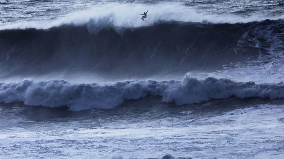 A surfer catches some air off a wave at Mavericks Beach near Half Moon Bay, California, on December 28. - Nathan Frandino/Reuters