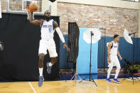 Dallas Mavericks forward Tim Hardaway Jr. (11) and center Dwight Powell participate in NBA basketball media day in Dallas, Monday, Sept. 26, 2022. (AP Photo/LM Otero)