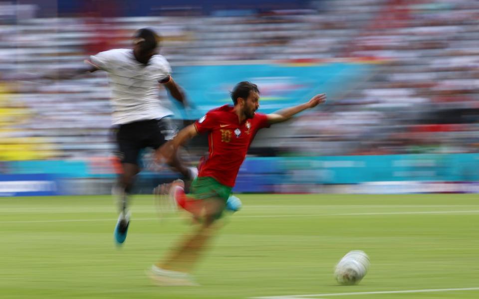 Blurred action shot of Bernardo Silva and Anthony Rudiger - REUTERS