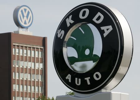 The logo of Skoda cars is seen beside main building of Volkswagen brand at the company's headquarters in Wolfsburg. The logo of Czech-based Skoda cars is seen beside the main building of its core Volkswagen brand at the company's headquarters in Wolfsburg July 13, 2005. REUTERS/Fabrizio Bensch/Files