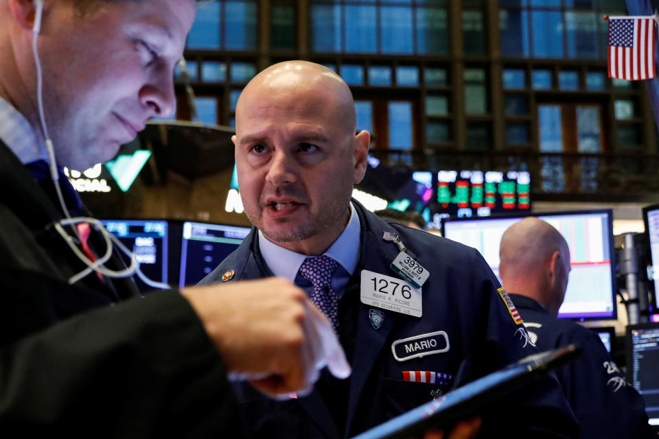 Traders work on the floor at the New York Stock Exchange (NYSE) in New York, U.S., October 9, 2019. REUTERS/Brendan McDermid