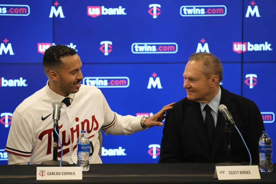 Minnesota Twins' Carlos Correa, left, and agent Scott Boras speak to the media during a baseball press conference at Target Field, Wednesday, Jan. 11, 2023, in Minneapolis. The team and Correa agreed to a six-year, $200 million contract. (AP Photo/Abbie Parr)