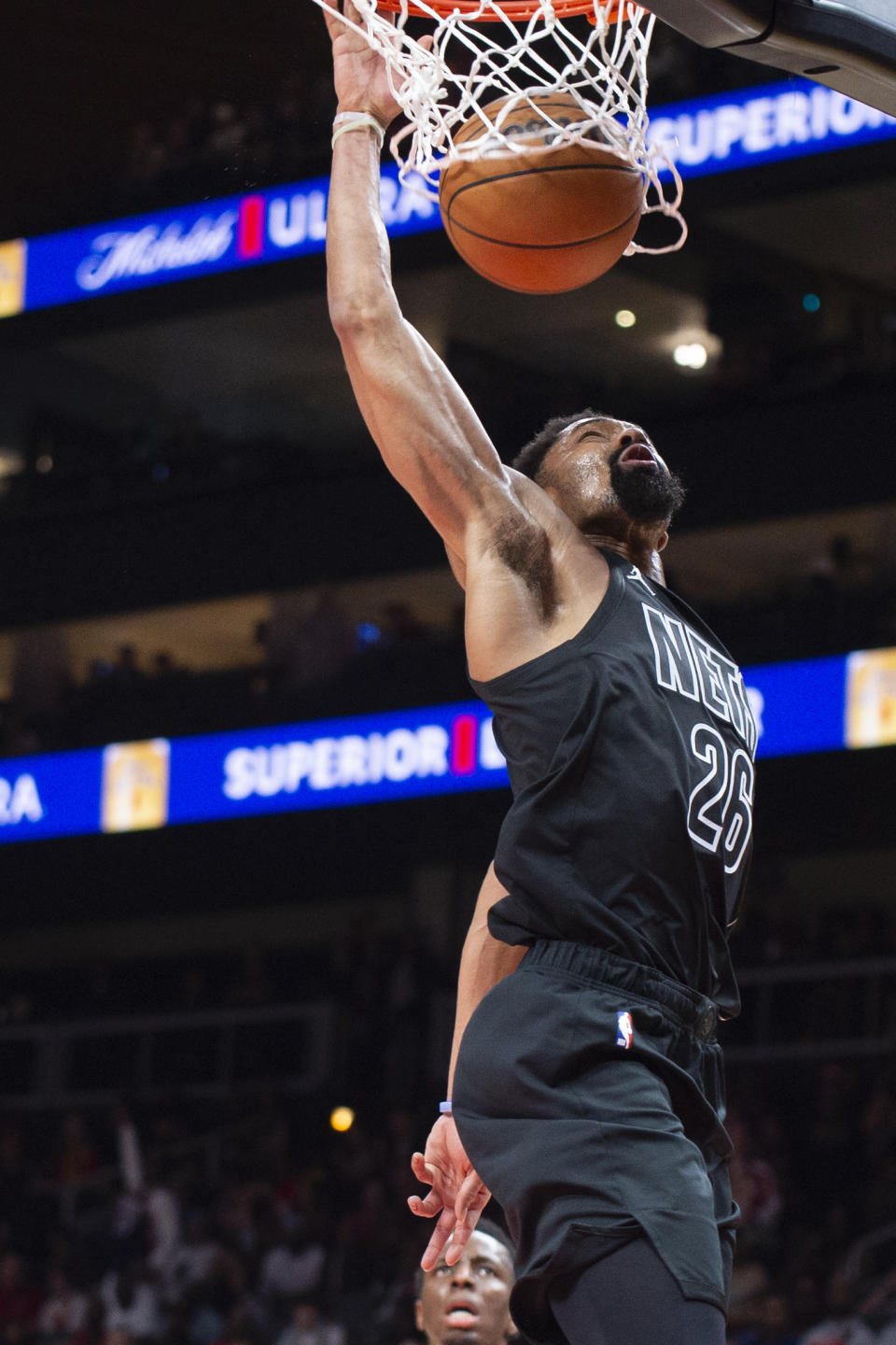 Brooklyn Nets guard Spencer Dinwiddie dunks during the second half of an NBA basketball game against the Atlanta Hawks, Sunday, Feb. 26, 2023, in Atlanta. (AP Photo/Hakim Wright Sr.)