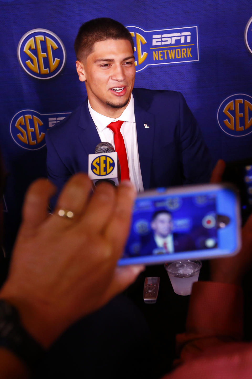 Mississippi quarterback Matt Corral speaks to reporters during the NCAA college football Southeastern Conference Media Days, Tuesday, July 16, 2019, in Hoover, Ala. (AP Photo/Butch Dill)