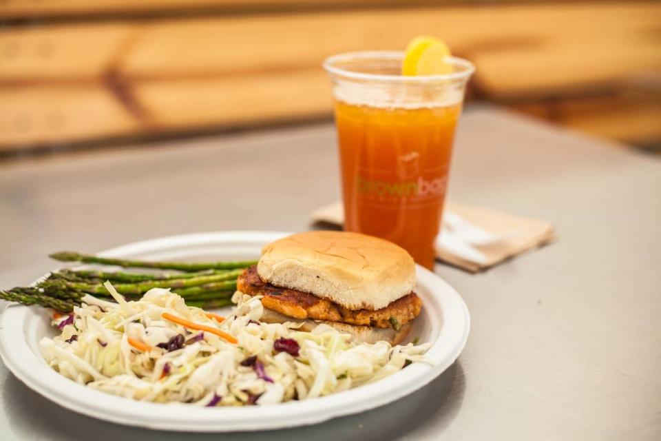 The salmon burger with grilled asparagus and berry slaw at Brown Bag.