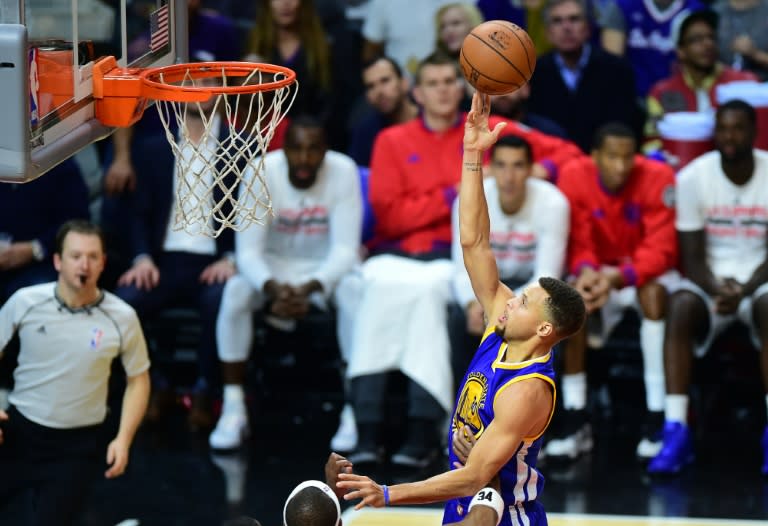 Steph Curry of the Golden State Warriors shoots under pressure from Paul Pierce of the Los Angeles Clippers during their Western Conference finals series