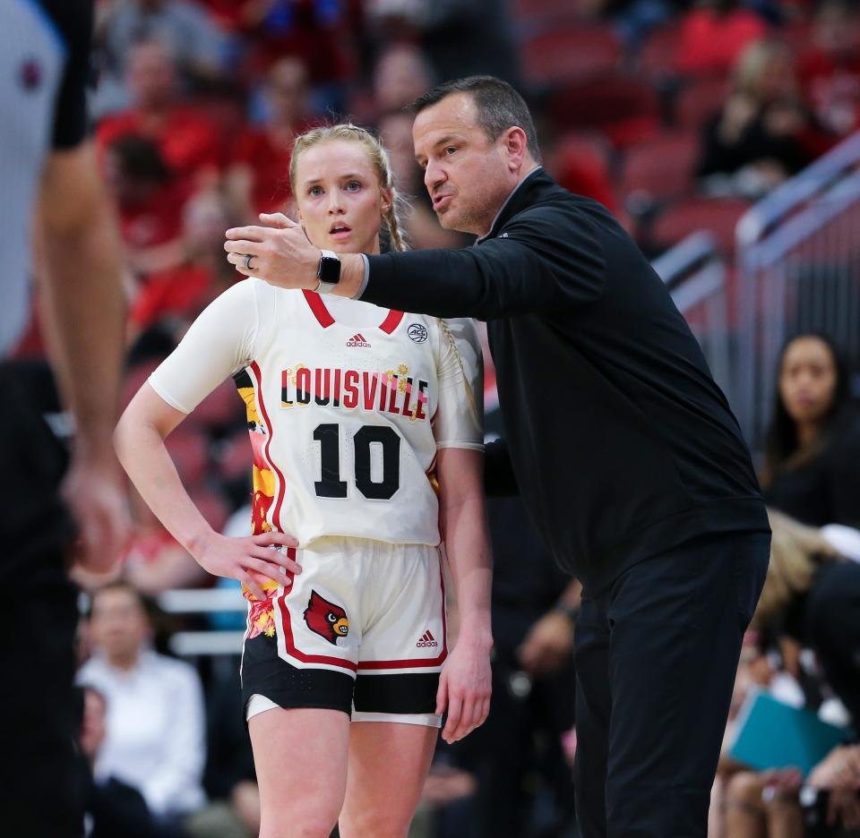 U of L head coach Jeff Walz instructs Hailey Van Lith (10) against Miami during their game at the Yum Center in Louisville, Ky. on Feb. 23, 2023.   