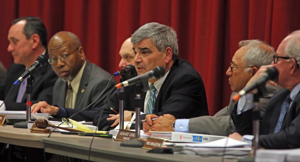 Chestnut Ridge Mayor Rosario Sam Presti listens to opponents make one final plea to protest over Places of Worship (POW) law before the Chestnut Ridge Board of Trustees make a decision during board meeting Chestnut Ridge Middle School Feb. 21, 2019. 