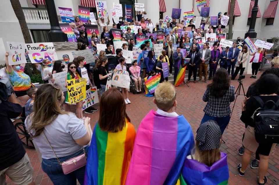 Demonstrators gather on the steps of the Florida Historic Capitol Museum in front of the Florida State Capitol, Monday, March 7, 2022, in Tallahassee, Fla. Wilfredo Lee/AP