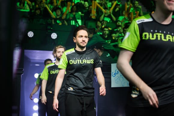 Overwatch League team entering the arena with cheering fans before a match.