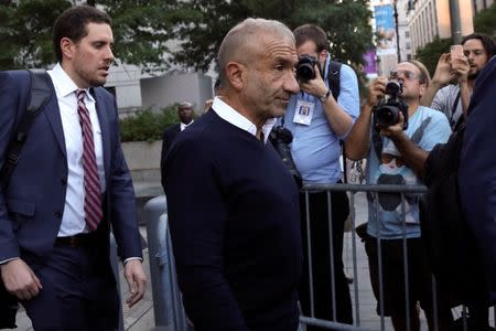 FILE PHOTO: Alain Kaloyeros (C), president of the State University of New York's Polytechnic Institute, walks out of the Manhattan federal courthouse in New York, U.S., September 22, 2016. REUTERS/Bria Webb