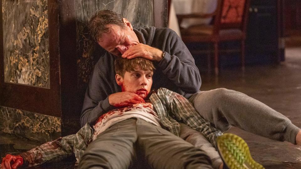 Michael Desiato (Bryan Cranston) cradles his dying son, Adam (Hunter Doohan) in the Season 1 finale of Showtime's "Your Honor."