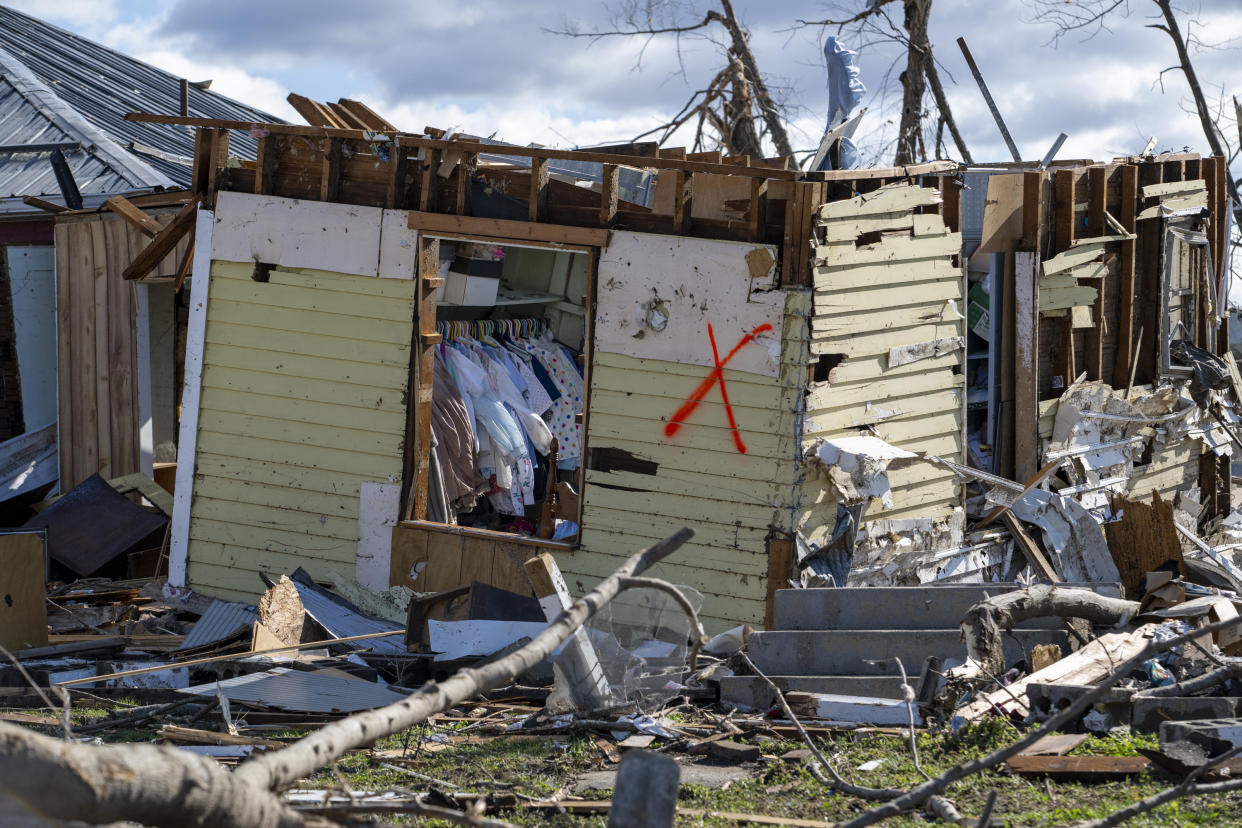 Damage from a late-night tornado is seen in Sullivan, Ind., Saturday, April 1, 2023. Multiple deaths were reported in the area following the storm. (AP Photo/Doug McSchooler)