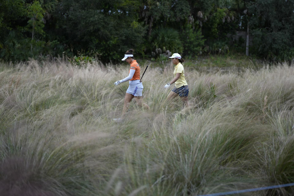 Nasa Hataoka, right, of Japan, and Su-Hyun Oh, of Australia, walk from the third tee to the fairway during the third round of the LPGA Tour Championship golf tournament Saturday, Nov. 20, 2021, in Naples, Fla. (AP Photo/Rebecca Blackwell)