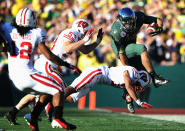 PASADENA, CA - JANUARY 02: Tight end David Paulson #42 of the Oregon Ducks leaps over a Wisconsin Badgers defender in the second quarter for a 10-yard gain at the 98th Rose Bowl Game on January 2, 2012 in Pasadena, California. (Photo by Harry How/Getty Images)