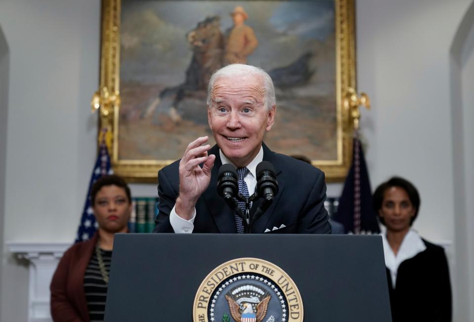 President Joe Biden speaks about deficit reduction in the Roosevelt Room at the White House in Washington, Friday, Oct. 21, 2022. Biden is flanked by, Office of Management and Budget Director Shalanda Young, left, and Council of Economic Advisers Chairwoman Cecilia Rouse.