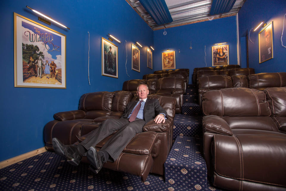 Graham Wildin chillaxing inside his cinema. (SWNS)