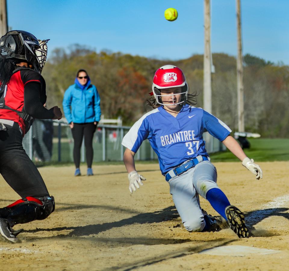 Braintree's Savana Littlewood slides into home plate ahead of the throw during a game against Milton on Monday, May 9, 2022.