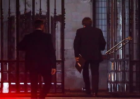 Catalan President Carles Puigdemont (R) arrives to the Generalitat, the regional government headquarters, in Barcelona, Spain, October 16, 2017. REUTERS/Gonzalo Fuentes