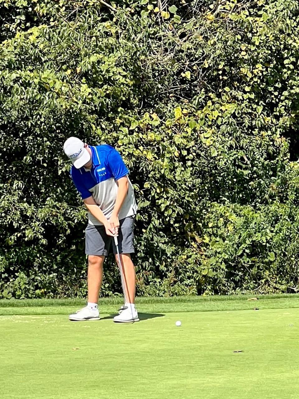 Highland's Emerson Grassbaugh putts the ball during the Mid Ohio Athletic Conference Boys Golf Tournament last week at the Country Club of Bucyrus.