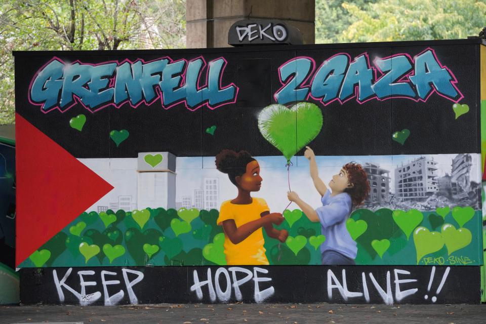 A mural in memory of Grenfell Tower is seen earlier this week in London linking the tragedy with the current war in Gaza (Copyright 2024 The Associated Press. All rights reserved)