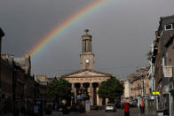 A rainbow arcs over the High Street in Elgin, Scotland, Britain May 18, 2017. REUTERS/Russell Cheyne