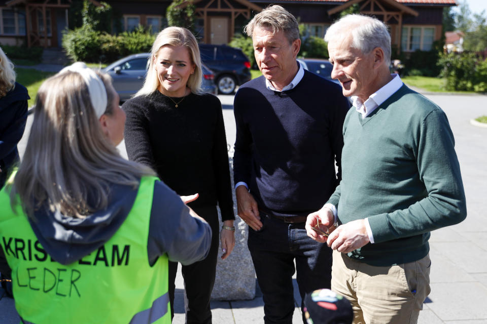 Norwegian Prime Minister Jonas Gahr Store, right, Minister of Justice and Emergency Emilie Enger Mehl, left, and Minister of Oil and Energy Terje Aasland, center, visit Ringerike municipality and Gran municipality in connection with the consequences of extreme weather, in Ringerike, Norway, Friday Aug. 11, 2023. (Frederik Ringnes/NTB Scanpix via AP)