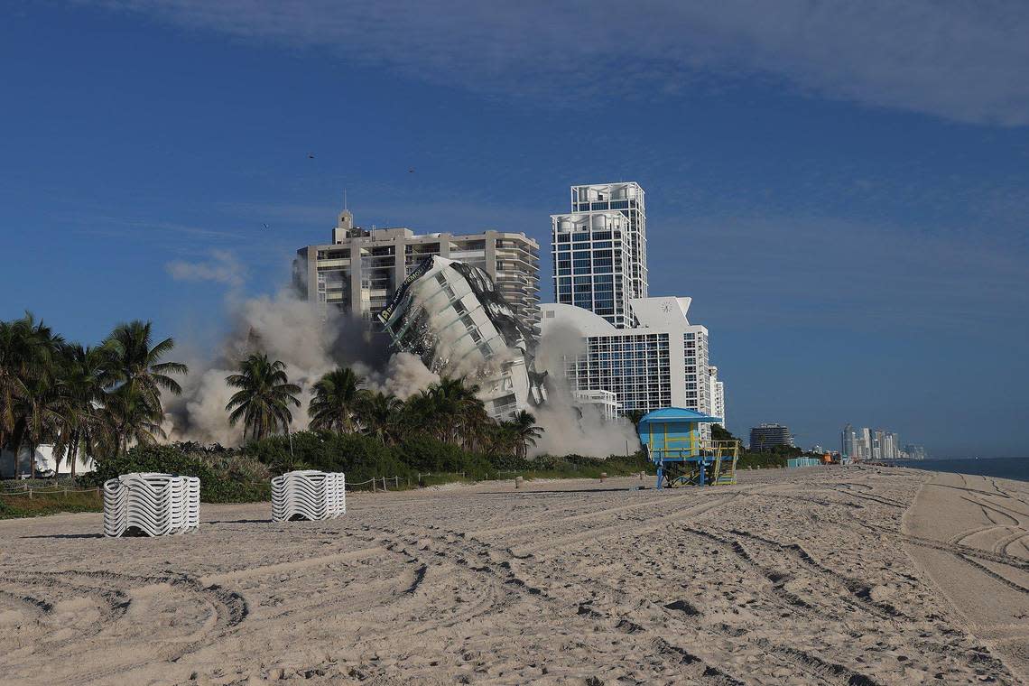 The 17-story hotel tower of the historic Deauville Beach Resort in Miami Beach is imploded Sunday, Nov. 13, 2022, around 8 a.m.