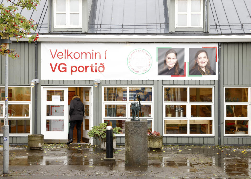 A man enters the Left Green Party election office in Reykjavik, Iceland, Wednesday, Sept. 22, 2021. Climate change is top of the agenda when voters in Iceland head to the polls for general elections on Saturday, following an exceptionally warm summer and an election campaign defined by a wide-reaching debate on global warming. Polls suggest Prime Minister Katrin Jakobsdottir's Left Green Party could face a poor outcome, ending the current coalition. (AP Photo/Brynjar Gunnarsson)