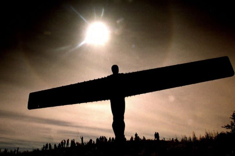 The sun shines over the Angel of the North before the solar eclipse of 1999