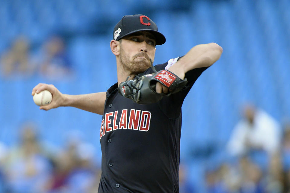 Cleveland Indians starting pitcher Shane Bieber (57) throws against the Toronto Blue Jays during the first inning of a baseball game, Wednesday, July 24, 2019 in Toronto. (Nathan Denette/Canadian Press via AP)