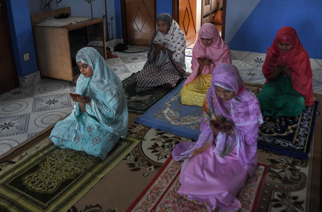 <span class="caption">Fasting is one of the five pillars of Islam.</span> <span class="attribution"><a class="link " href="https://www.gettyimages.com/detail/news-photo/family-members-offer-a-special-prayer-in-their-home-during-news-photo/1232878046?adppopup=true" rel="nofollow noopener" target="_blank" data-ylk="slk:Prakash Mathema/AFP via Getty Images;elm:context_link;itc:0;sec:content-canvas">Prakash Mathema/AFP via Getty Images</a></span>