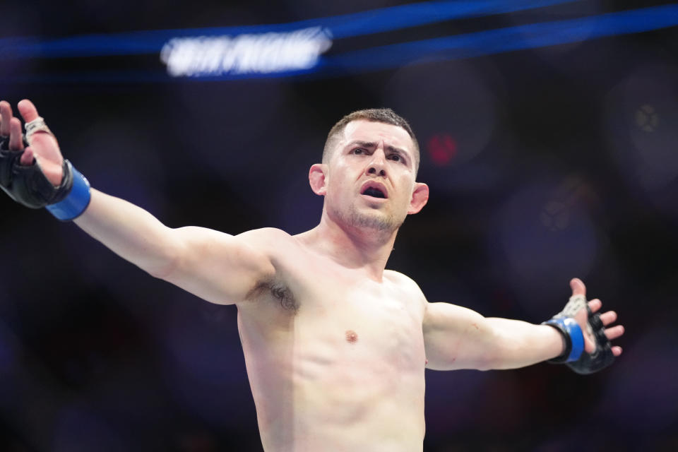 Apr 8, 2023; Miami, Florida, USA; Steve Garcia (blue gloves) reacts after defeating Shayilan Nuerdanbieke (red gloves) during UFC 287 at Miami-Dade Arena. Mandatory Credit: Rich Storry-USA TODAY Sports