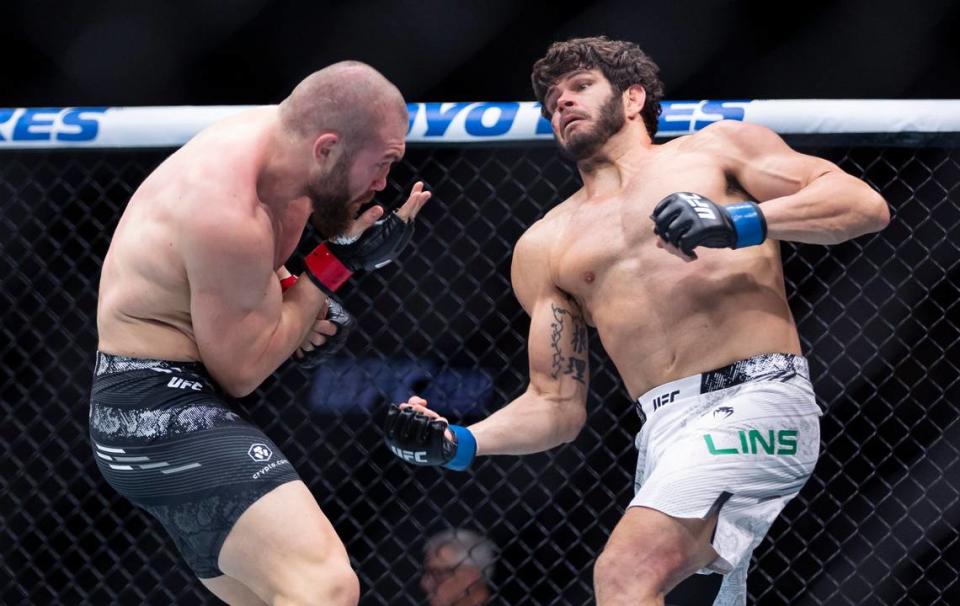 Ion Cutelaba from Moldova fights against Philipe Lins of Brazil during their light heavyweight title match during the UFC 299 event at the Kaseya Center on Saturday, March 9, 2024, in downtown Miami, Fla. MATIAS J. OCNER/mocner@miamiherald.com