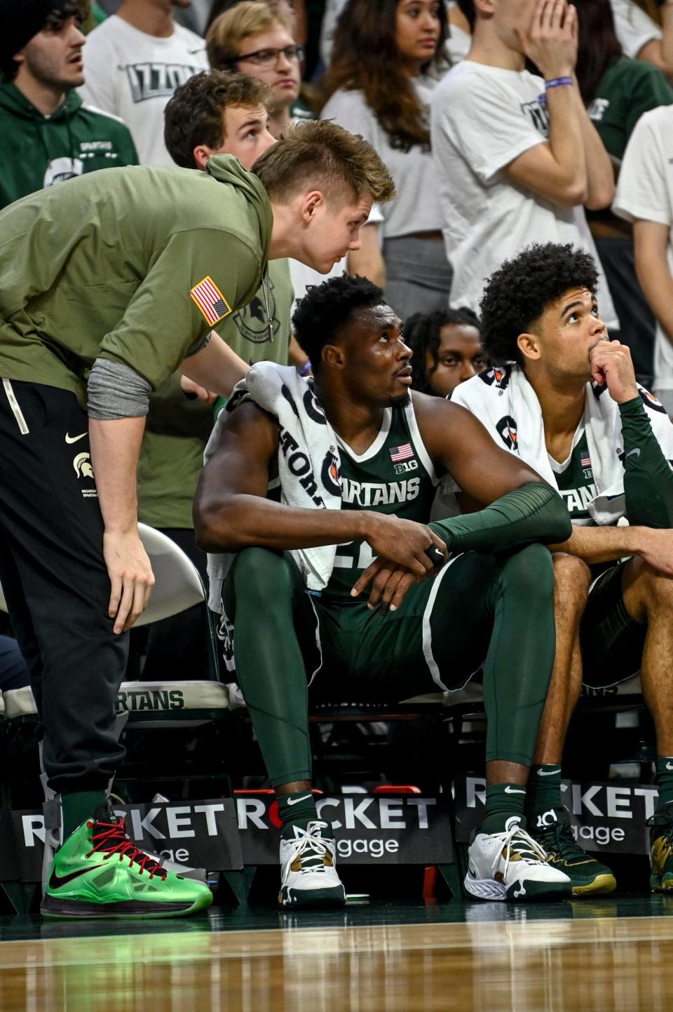Michigan State's Mady Sissoko, center, Jaxon Kohler, left, and Malik Hall look on from the bench late against Southern Indiana during the second half on Thursday, Nov. 9, 2023, at the Breslin Center in East Lansing.
