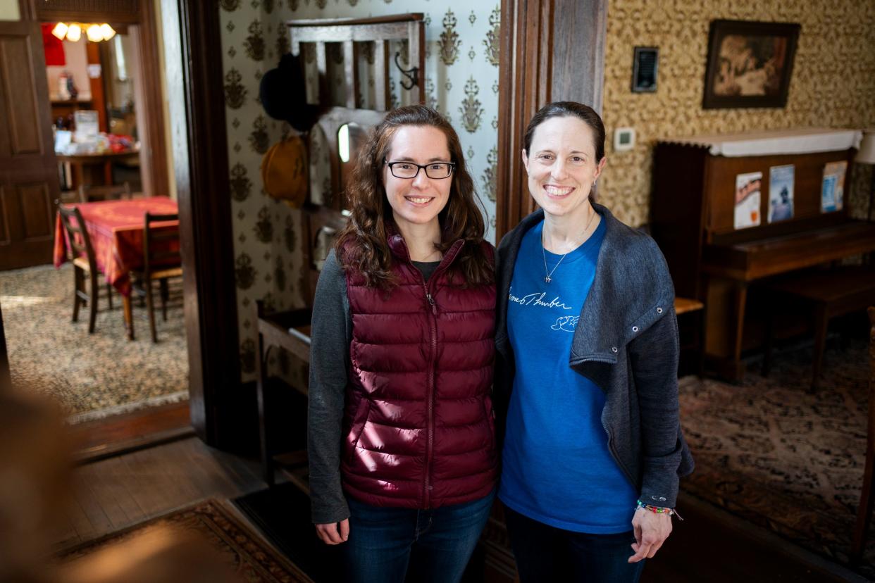 Meg Brown, director of children's education, right, and Leah Wharton, left, operations director for Thurber House, help celebrate the 40th anniversary of Thurber House.