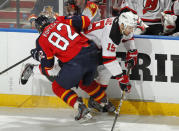 SUNRISE, FL - APRIL 21: Tomas Kopecky #82 of the Florida Panthers checks Petr Sykora #15 of the New Jersey Devils in Game Five of the Eastern Conference Quarterfinals during the 2012 NHL Stanley Cup Playoffs at the BankAtlantic Center on April 21, 2012 in Sunrise, Florida. The Panthers defeated the Devils 3-0. (Photo by Joel Auerbach/Getty Images)