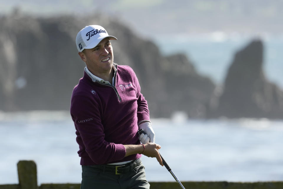 Justin Thomas watches his shot from the 18th tee at Pebble Beach Golf Links during the second round of the AT&T Pebble Beach National Pro-Am golf tournament in Pebble Beach, Calif., Friday, Feb. 2, 2024. (AP Photo/Eric Risberg)