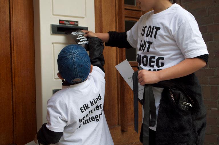 Marching door to door in Amsterdam, the children chant: 'Don't think black, don't think white, don't think black and white: think the colours of your heart.'