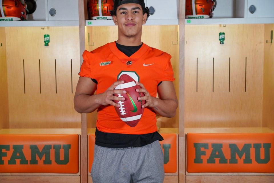 Transfer quarterback Jeremy Moussa poses in the locker room at FAMU. He signed with the Rattlers after first being at Vanderbilt.