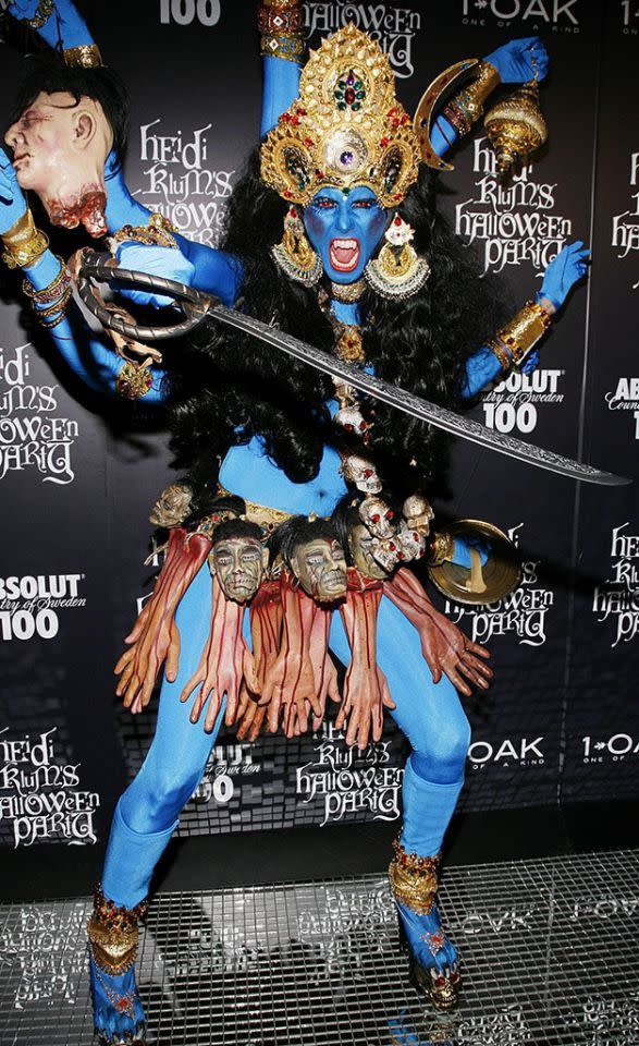 <p>No. 18: In 2008, Heidi went all out as Kali, the Hindu goddess of destruction. With a base of a blue bodysuit (and matching face paint), it was all about the accessories, which included heads, hands, red beady eyes, and a sword. While it was a memorable look, it wasn’t a winner for everyone. Her portrayal of the deity with vampire fangs and a skirt made of severed bloody hands upset Hindu leaders. Offending people with your costume puts it at the bottom of the list. (Photo: Joe Kohen/WireImage) </p>