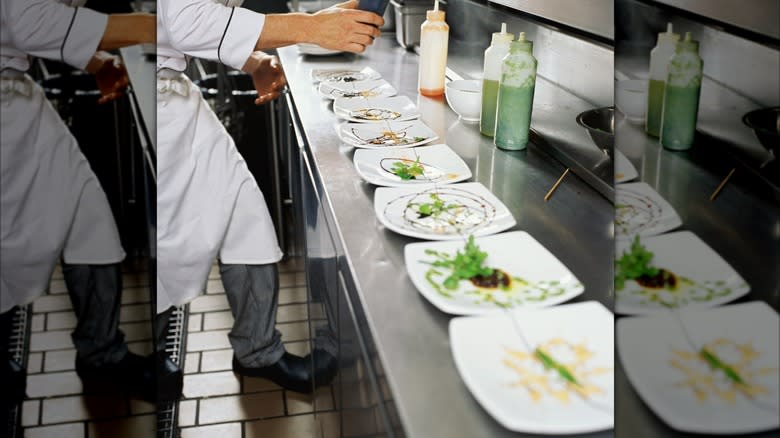 chef by row of plates