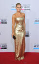 <b>Best dressed: Elisha Cuthbert</b><br><br>The Girl Next Door actress wore a simple but stylish gold full-length gown, which she teamed with a black clutch, barely there make-up and a scraped back do.