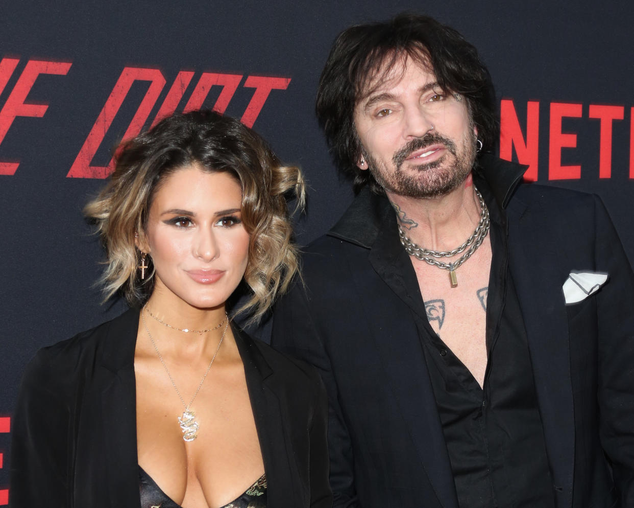 HOLLYWOOD, CALIFORNIA - MARCH 18: Tommy Lee (R) and his Wife Brittany Furlan (L) attend the Premiere Of Netflix's "The Dirt" at ArcLight Hollywood on March 18, 2019 in Hollywood, California. (Photo by Paul Archuleta/FilmMagic)