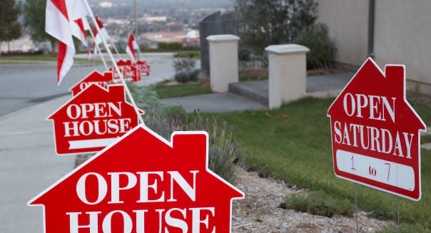 red and white open house sign...