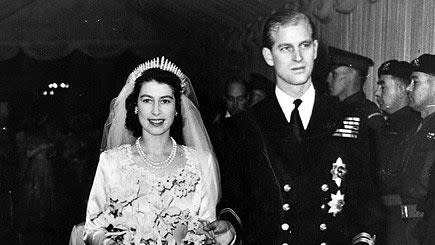 Queen Elizabeth II, as Princess Elizabeth, and her husband the Duke of Edinburgh, styled Prince Philip in 1957, on their wedding day. She became queen on her father King George VI's death in 1952.