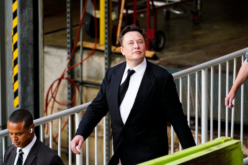 Elon Musk walks from the justice center in Wilmington on Monday, July 12, 2021. Musk took to a witness stand to defend his company's 2016 acquisition of a troubled company called SolarCity against a shareholder lawsuit that claims he's to blame for a deal that was rife with conflicts of interest and never delivered the profits he had promised.