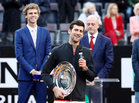 Tennis - ATP 1000 - Italian Open - Foro Italico, Rome, Italy - May 19, 2019 Serbia's Novak Djokovic with the runner up trophy after losing the final against Spain's Rafael Nadal REUTERS/Matteo Ciambelli